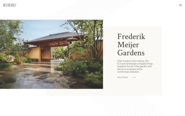 Frederik Meijer Gardens entrance showcasing a serene landscape with lush greenery and stone pathways, reflecting the artistic integration of nature and sculpture.